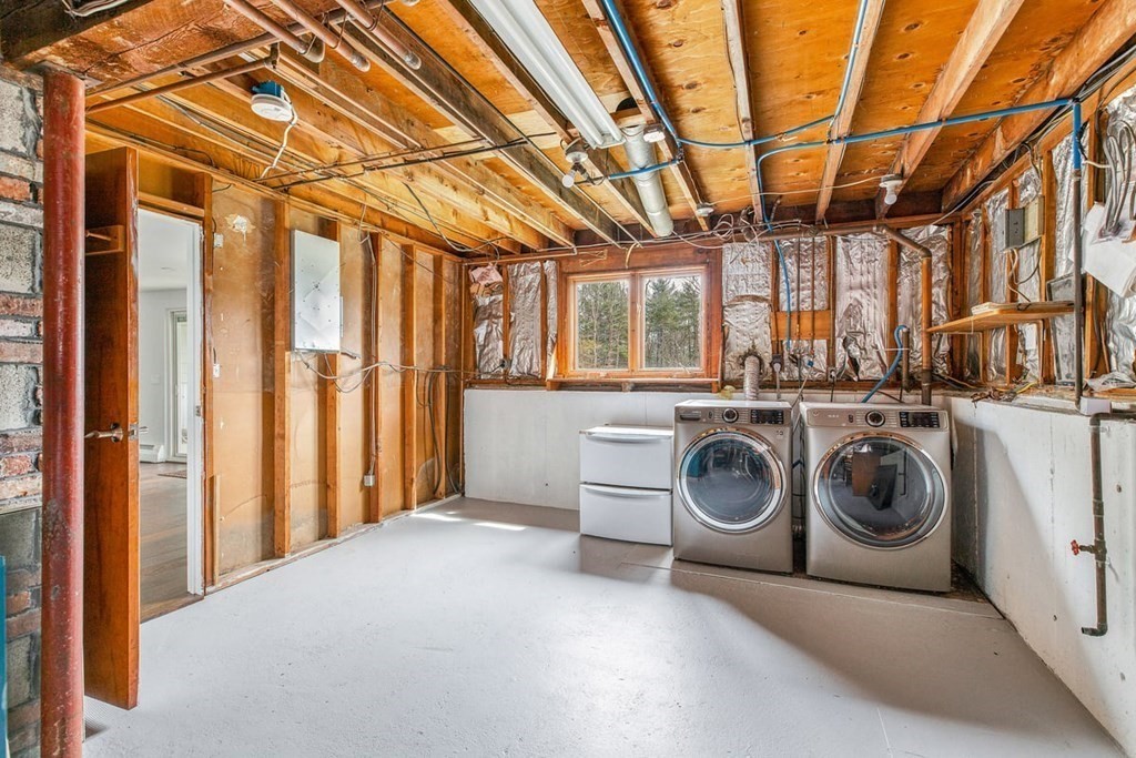 56 James Road Hanover, MA 02339 - Photo 24 of 31 a view of a storage and utility room with washer and dryer