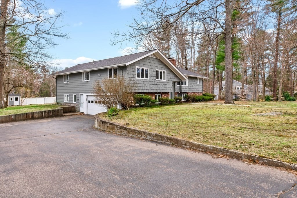 56 James Road Hanover, MA 02339 - Photo 28 of 31 a front view of a house with a yard and garage
