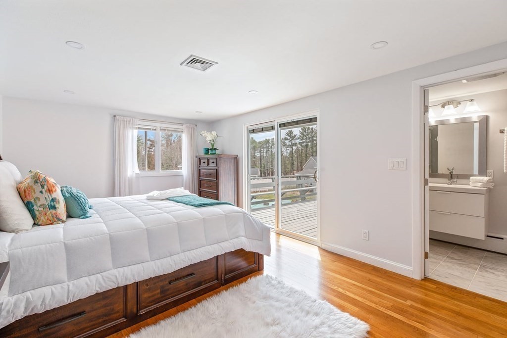 56 James Road Hanover, MA 02339 - Photo 10 of 31 a bedroom with a bed and wooden floor