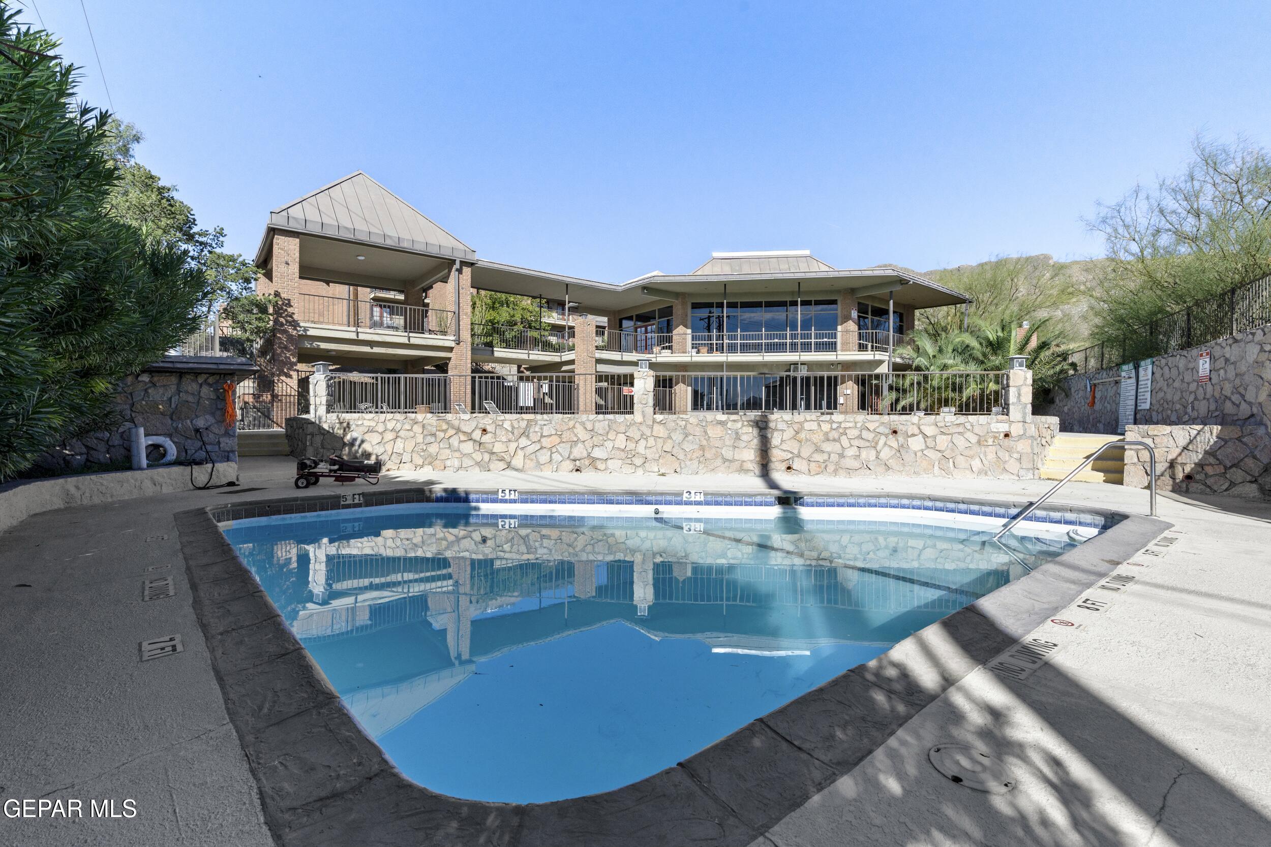 4433 North Stanton Street, Unit P358 El Paso, TX 79912 - Photo 18 of 19 a view of a swimming pool with outdoor seating