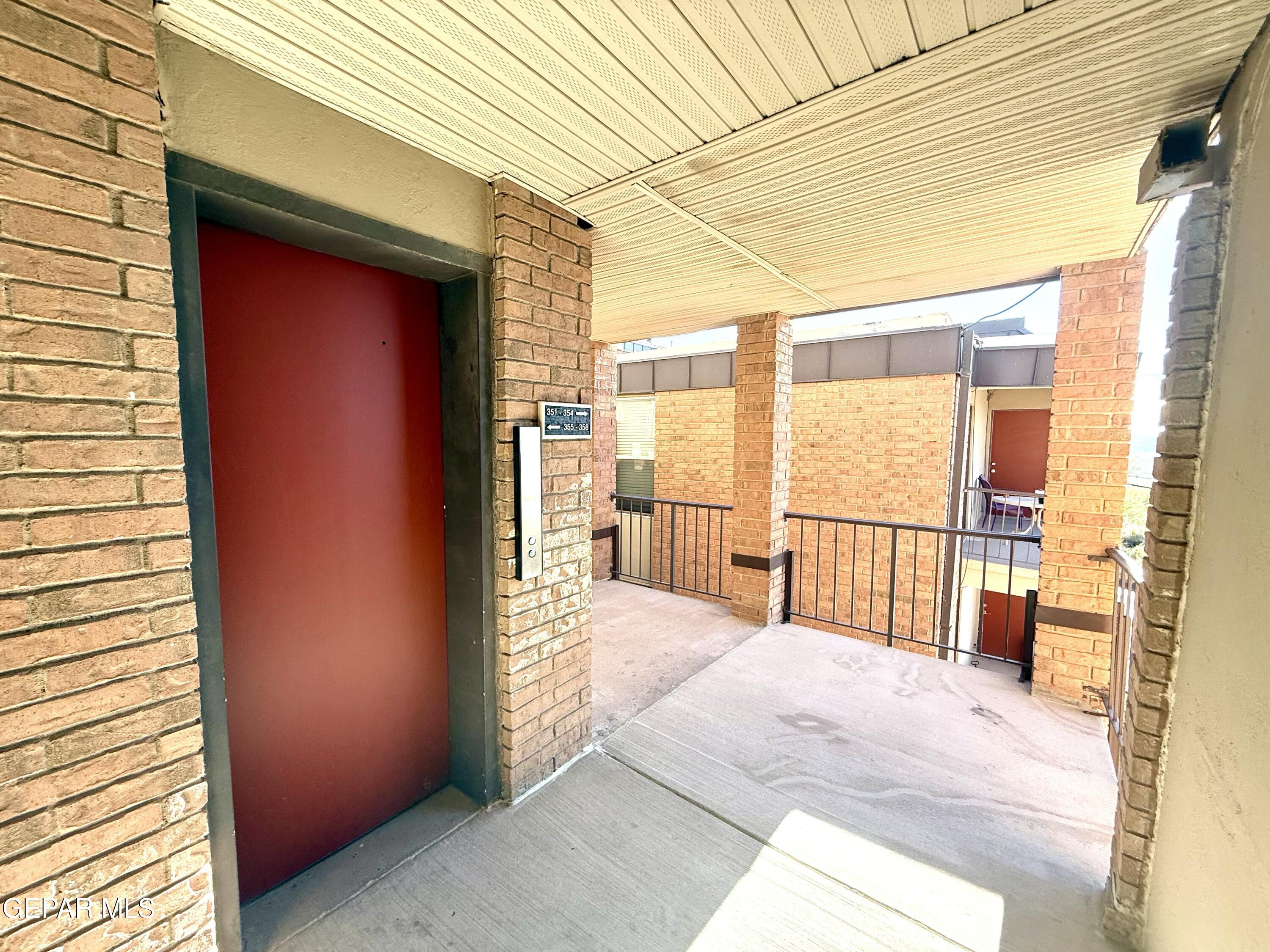 4433 North Stanton Street, Unit P358 El Paso, TX 79912 - Photo 4 of 19 a view of a porch with a table and chairs