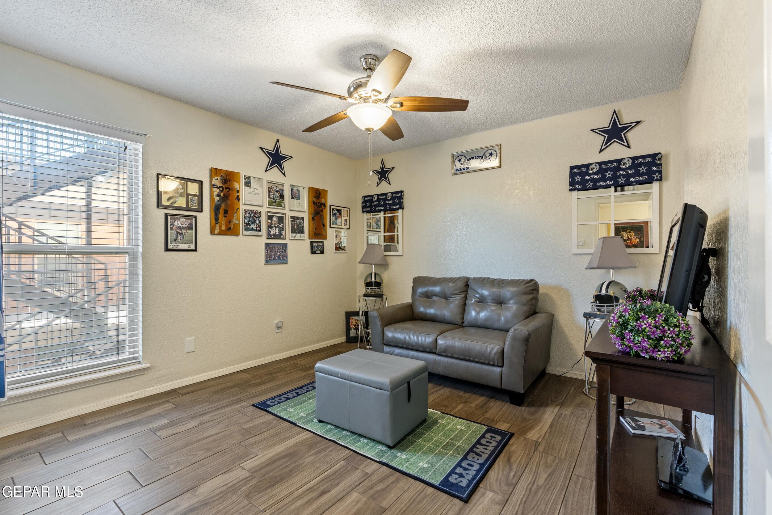 4433 North Stanton Street, Unit P358 El Paso, TX 79912 - Photo 9 of 19 a living room with furniture and wooden floor