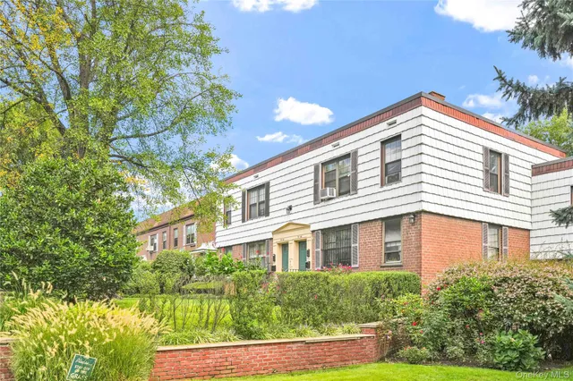 a picture of a bench in front of a wall