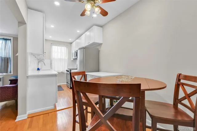 a view of a dining room with furniture and a chandelier