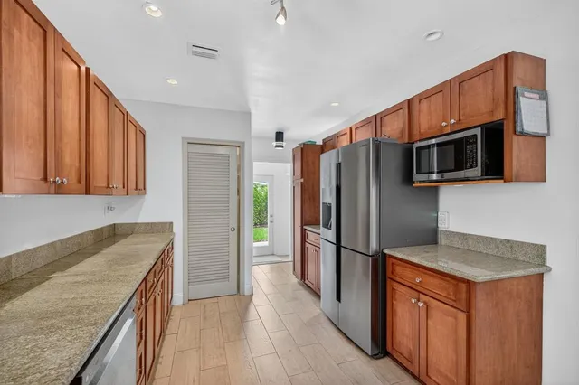 a living room with furniture and large flat screen tv