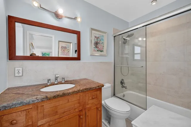 a bed room with a bed and a window