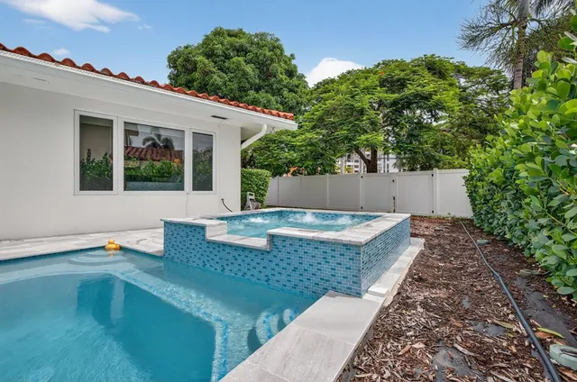 a view of a balcony with two chairs