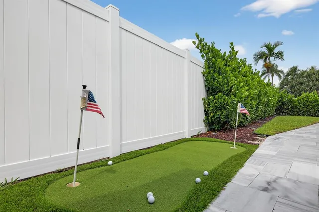 an outdoor space with lots of tables and chairs