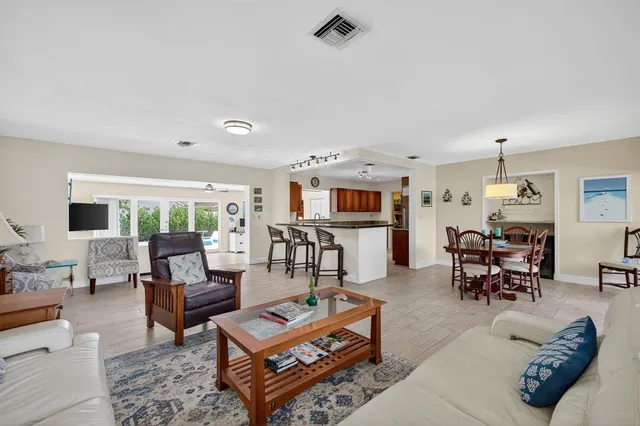 a kitchen with stainless steel appliances a stove a sink and a refrigerator