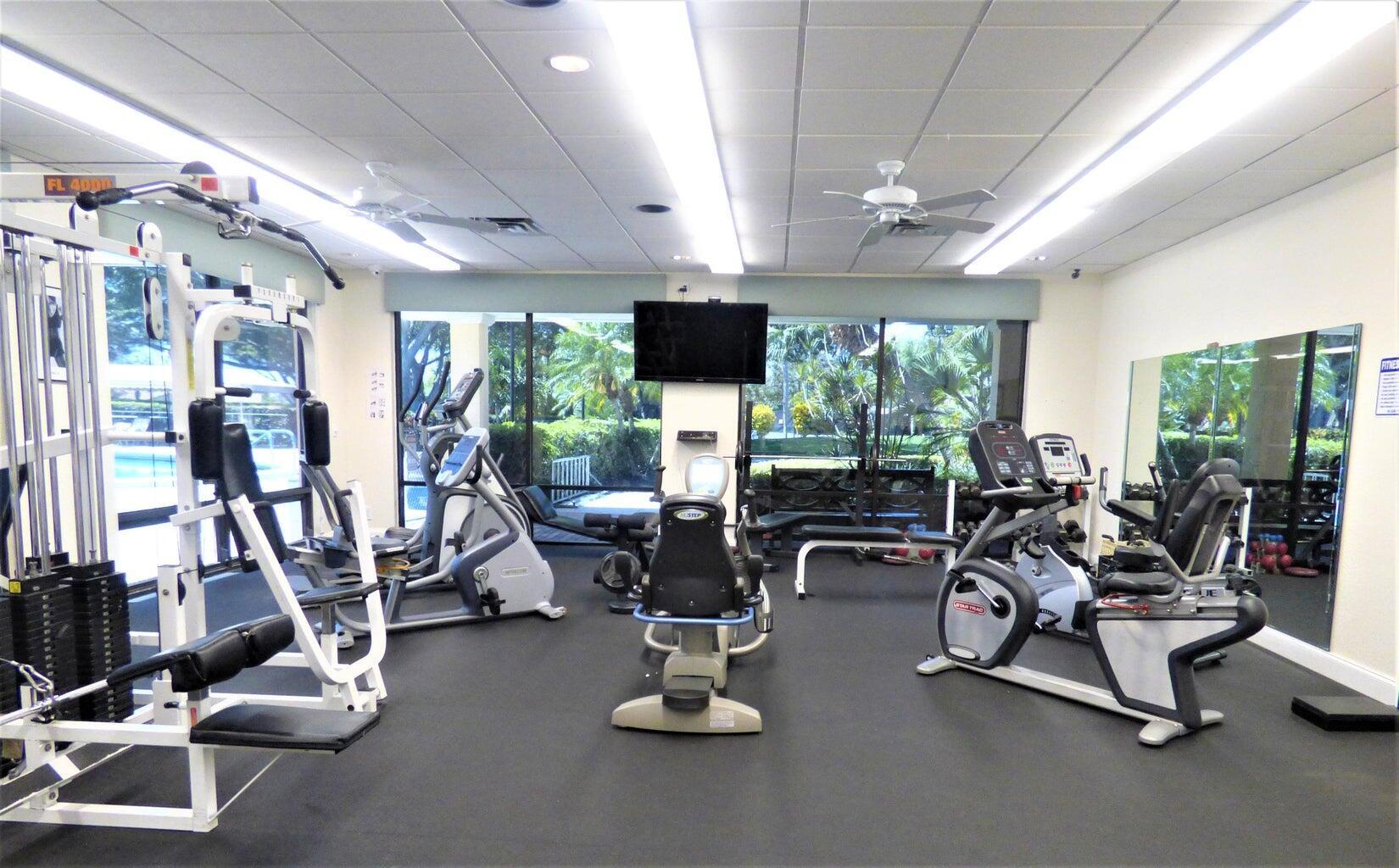 2686 Northwest 7th Court, Unit C Delray Beach, FL 33445 - Photo 19 of 33 a view of a room with gym equipment
