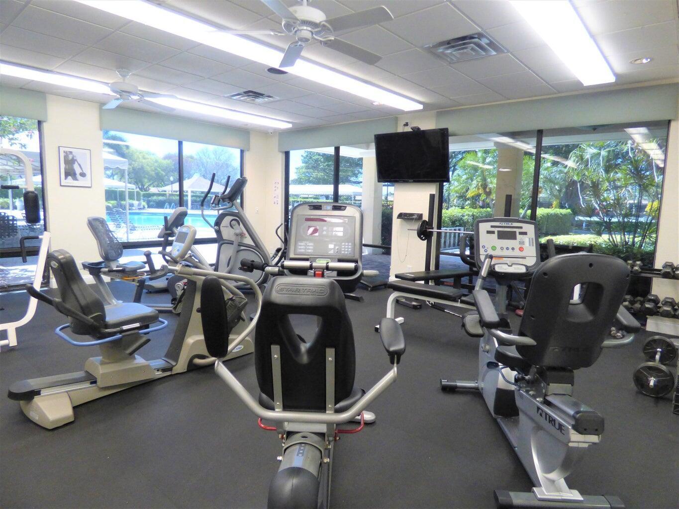 2686 Northwest 7th Court, Unit C Delray Beach, FL 33445 - Photo 21 of 33 a view of a room with gym equipment