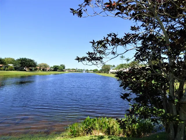 a view of a lake with a house in the background