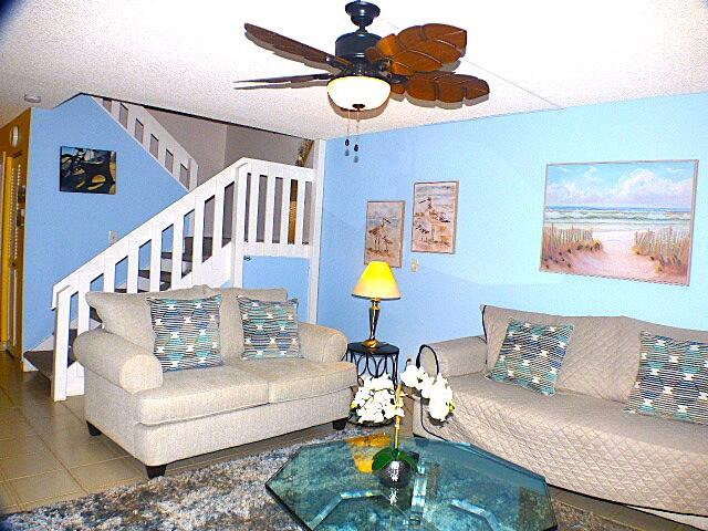 2686 Northwest 7th Court, Unit C Delray Beach, FL 33445 - Photo 6 of 33 a living room with furniture and a chandelier