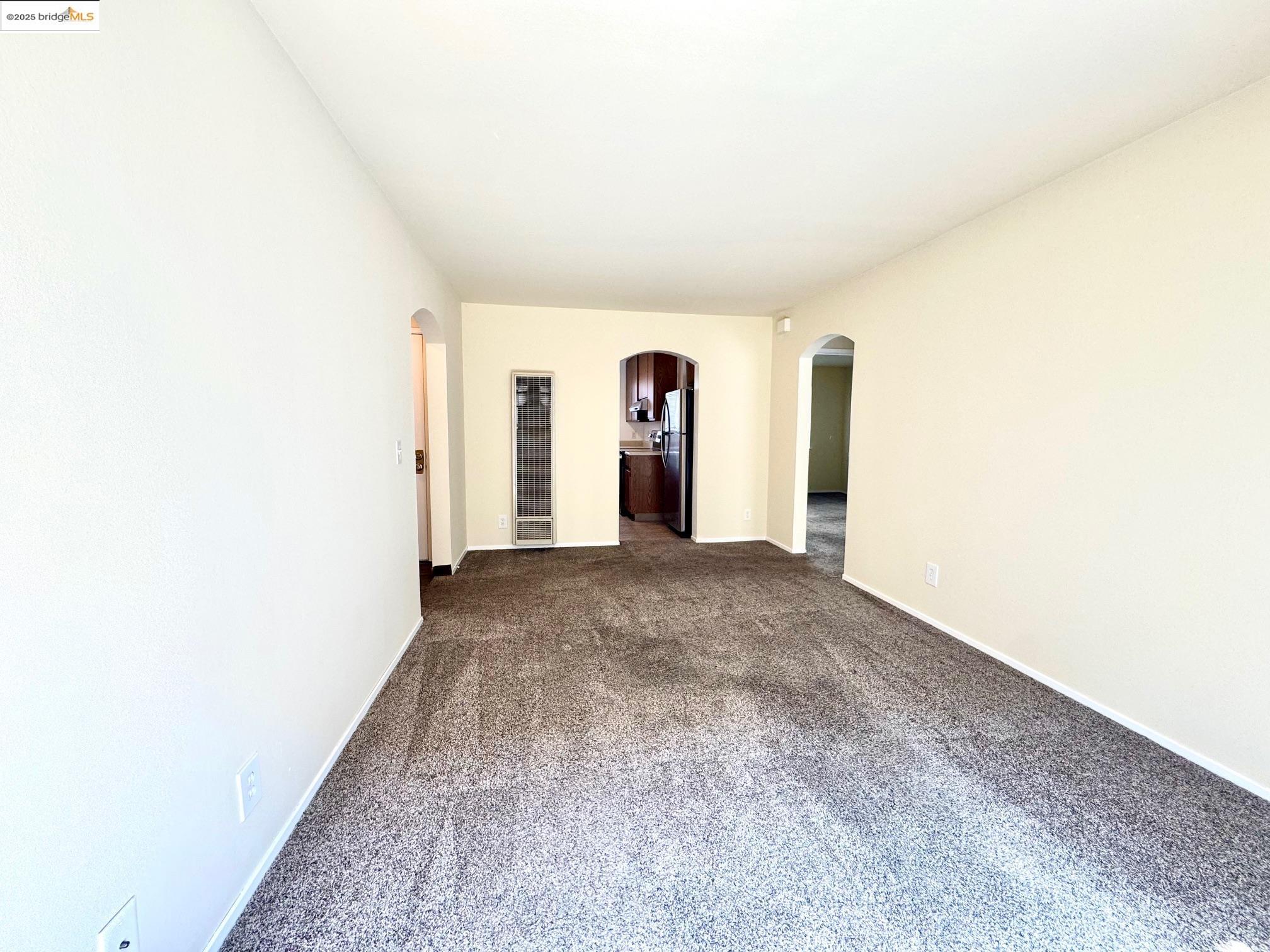 554 Bancroft Avenue, Unit 101 San Leandro, CA 94577 - Photo 12 of 17 a view of a room with a hallway