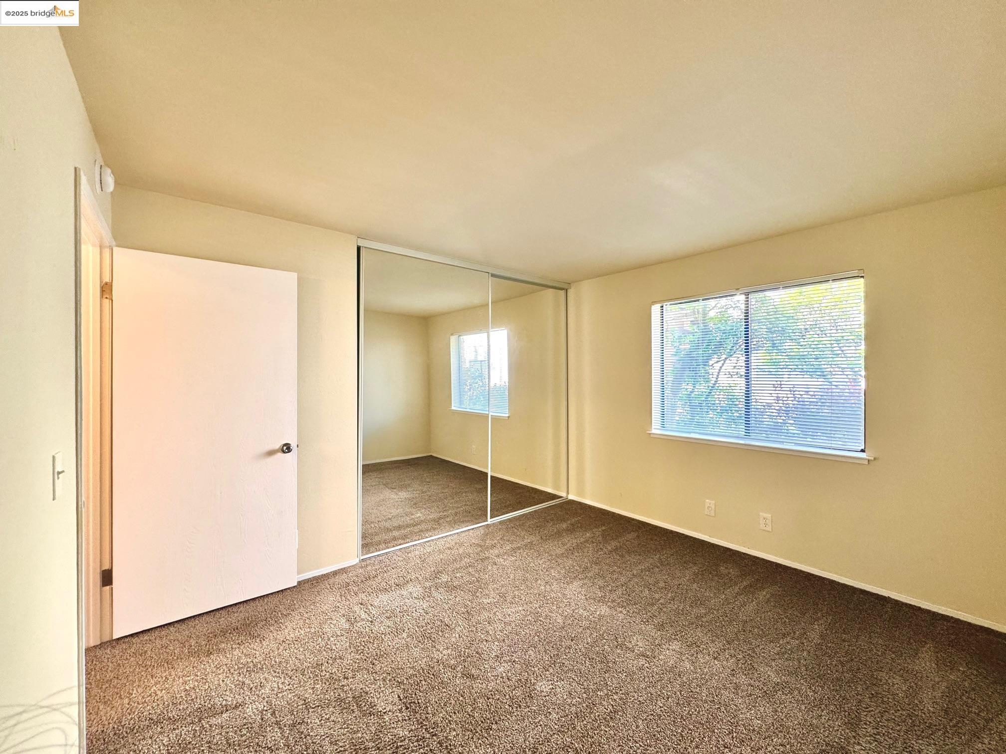 554 Bancroft Avenue, Unit 101 San Leandro, CA 94577 - Photo 13 of 17 an empty room with windows