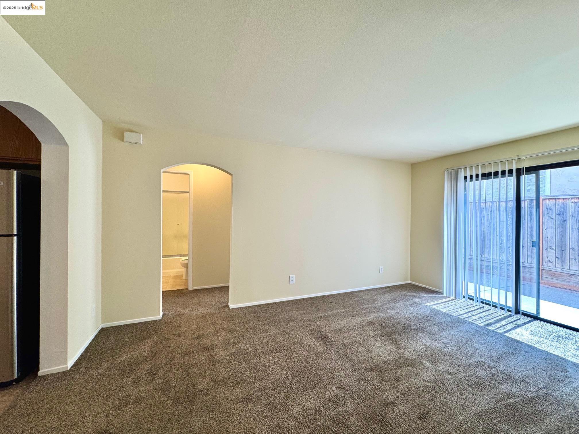 554 Bancroft Avenue, Unit 101 San Leandro, CA 94577 - Photo 8 of 17 an empty room with closet area