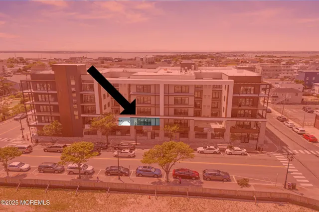 an aerial view of a building with an outdoor space