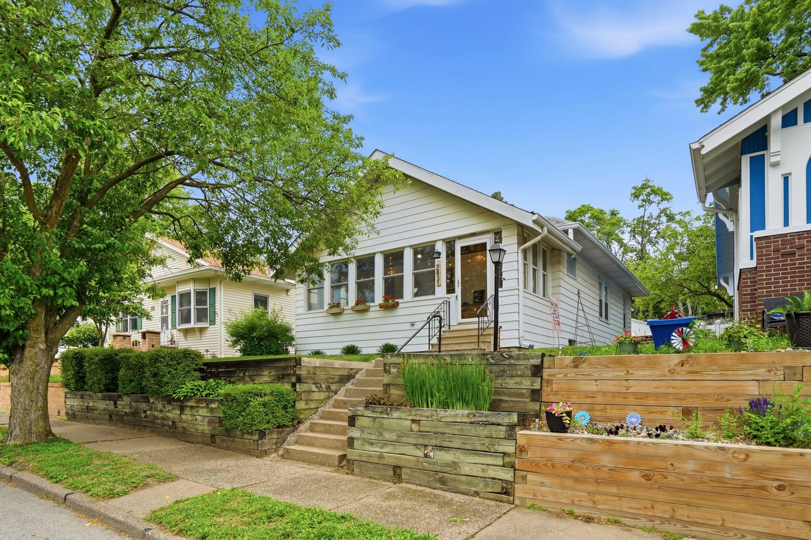 2431 14th Avenue Moline, IL 61265 - Photo 3 of 37 a front view of a house with a yard