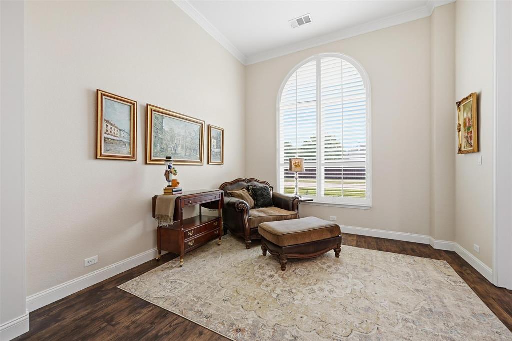 9305 Anns Way Plano, TX 75025 - Photo 17 of 39 Sitting room featuring crown molding and dark wood-style flooring