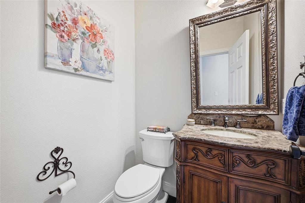 9305 Anns Way Plano, TX 75025 - Photo 20 of 39 Bathroom with vanity and toilet