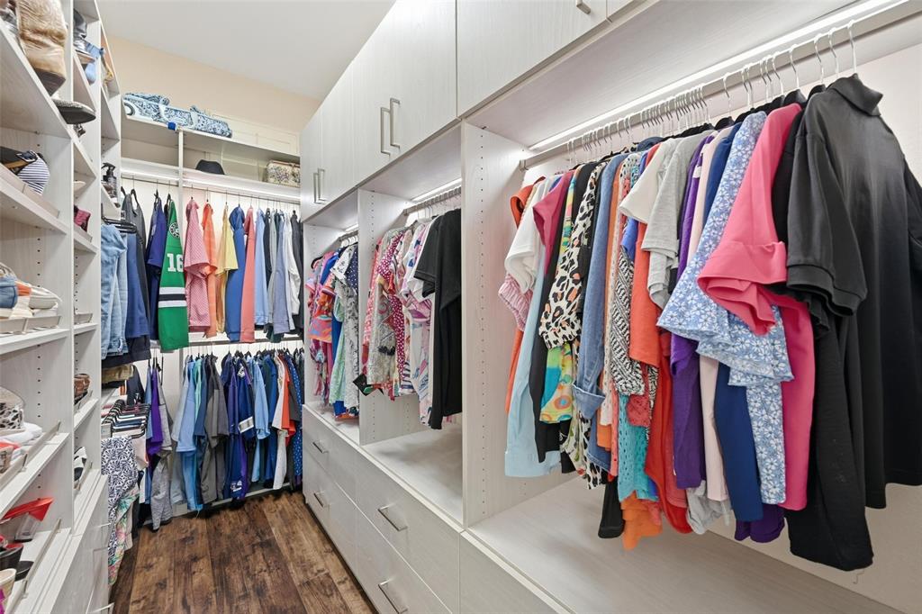 9305 Anns Way Plano, TX 75025 - Photo 21 of 39 Walk in closet with dark wood-style floors