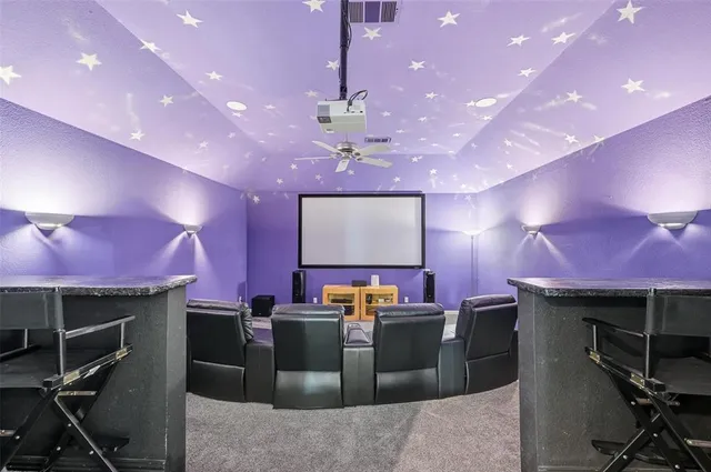 a kitchen with a chandelier appliances and a dining room