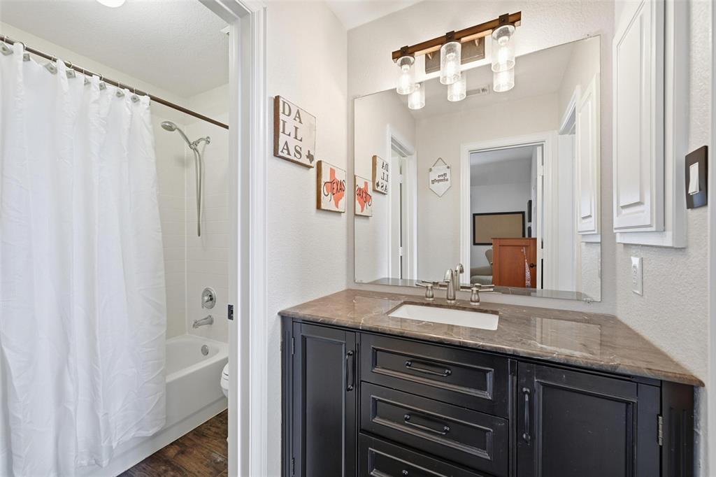 9305 Anns Way Plano, TX 75025 - Photo 27 of 39 Full bathroom featuring dark wood-style floors, shower / bath combo, and vanity