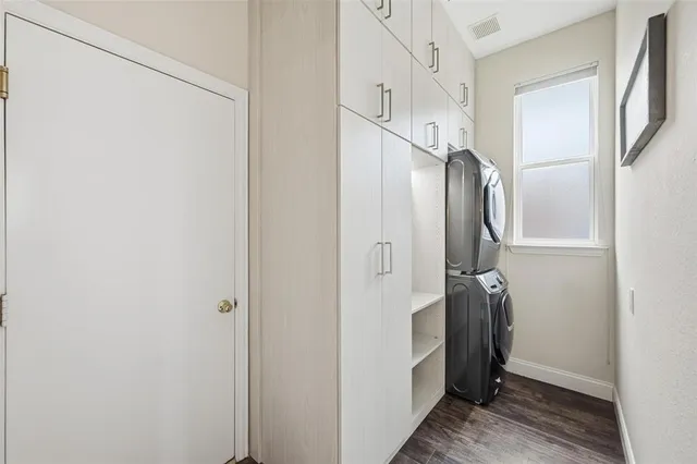 a bathroom with a glass shower door and a sink