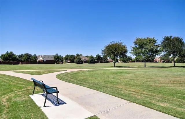 a view of a playground with basketball court