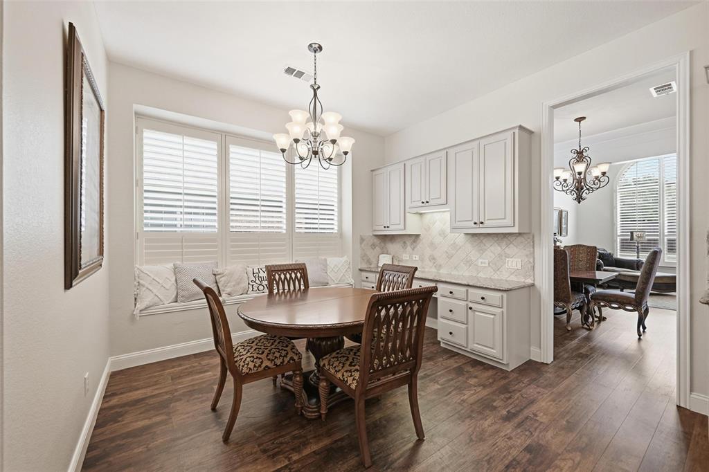 9305 Anns Way Plano, TX 75025 - Photo 8 of 39 Dining room featuring a chandelier and dark wood finished floors