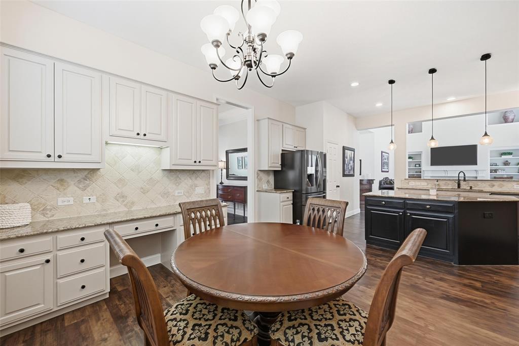 9305 Anns Way Plano, TX 75025 - Photo 10 of 39 Dining space with dark wood-style floors, a chandelier, and recessed lighting
