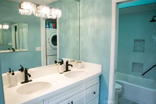 a bathroom with a glass shower door and a mirror