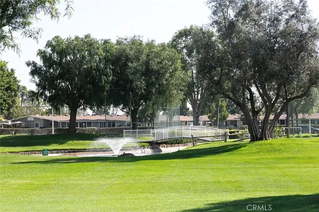 a view of a swimming pool with a big yard