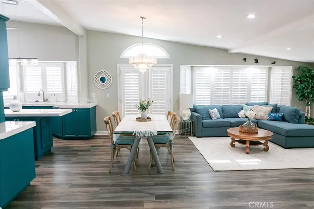 a view of a yard with plants and a fountain