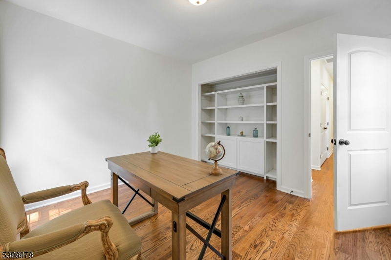 26 Woodland Road Morristown, NJ 07960 - Photo 19 of 26 a workspace with furniture and wooden floor