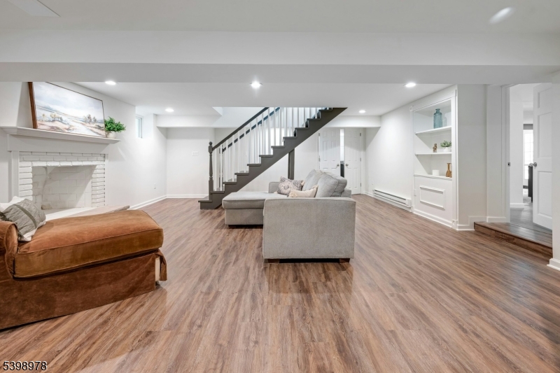 26 Woodland Road Morristown, NJ 07960 - Photo 20 of 26 a living room with furniture and a wooden floor