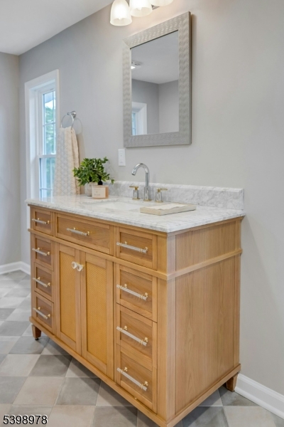 26 Woodland Road Morristown, NJ 07960 - Photo 23 of 26 a bathroom with a sink and a mirror