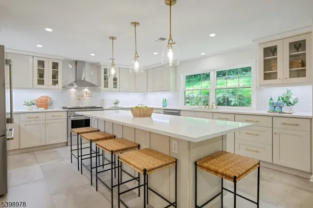 a kitchen with a stove a sink and a refrigerator