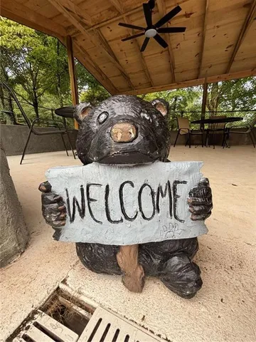 a view of outdoor space with a table and chairs