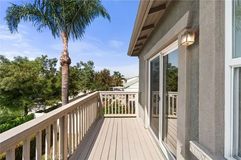 a view of balcony with furniture