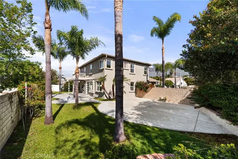 a view of a house with swimming pool and porch with furniture