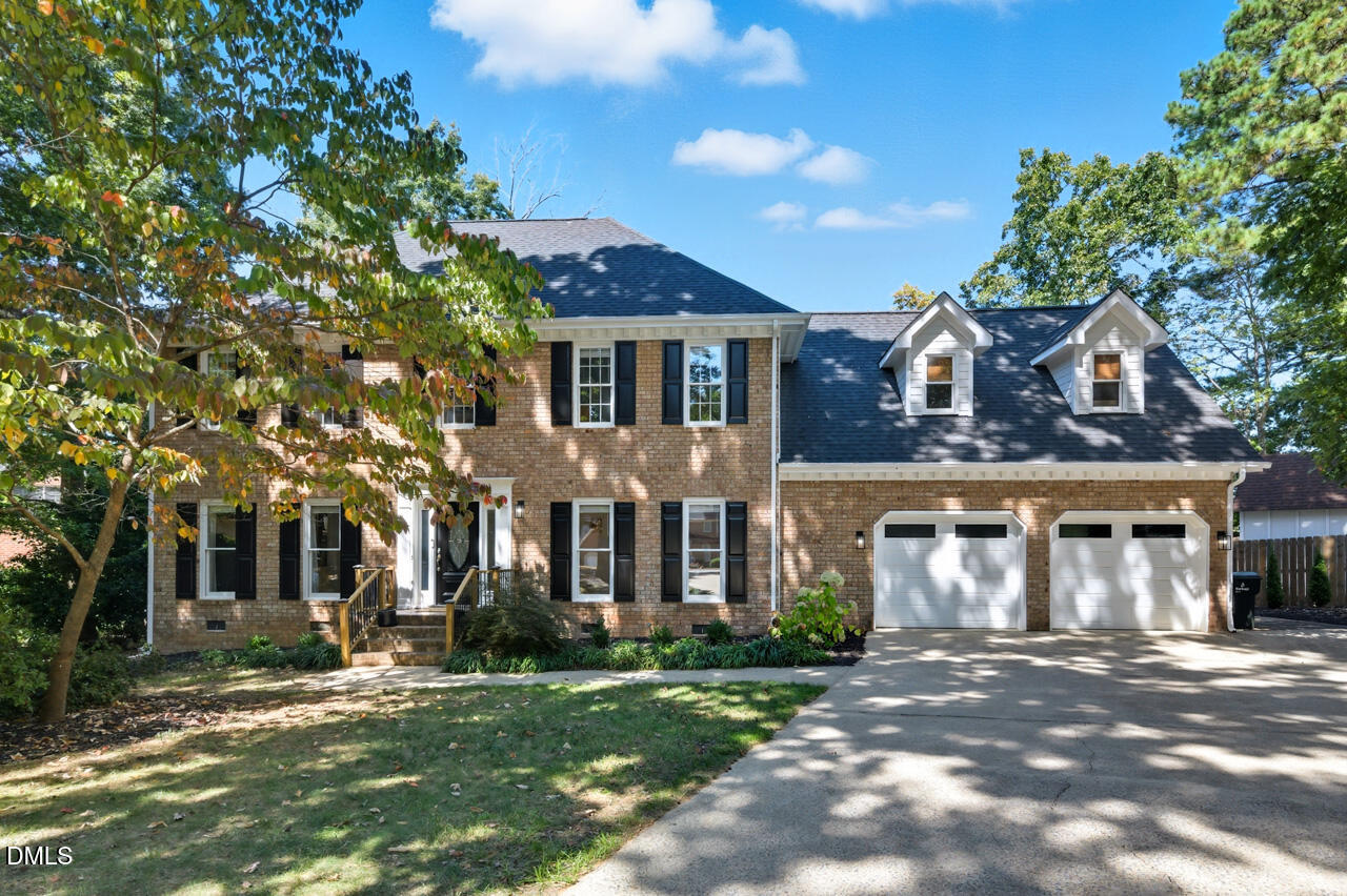 8713 Mourning Dove Road Raleigh, NC 27615 - Photo 2 of 56 front view of a house with a yard