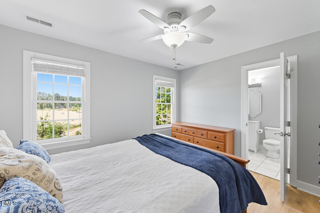 8713 Mourning Dove Road Raleigh, NC 27615 - Photo 30 of 56 a bedroom with a large bed and a window