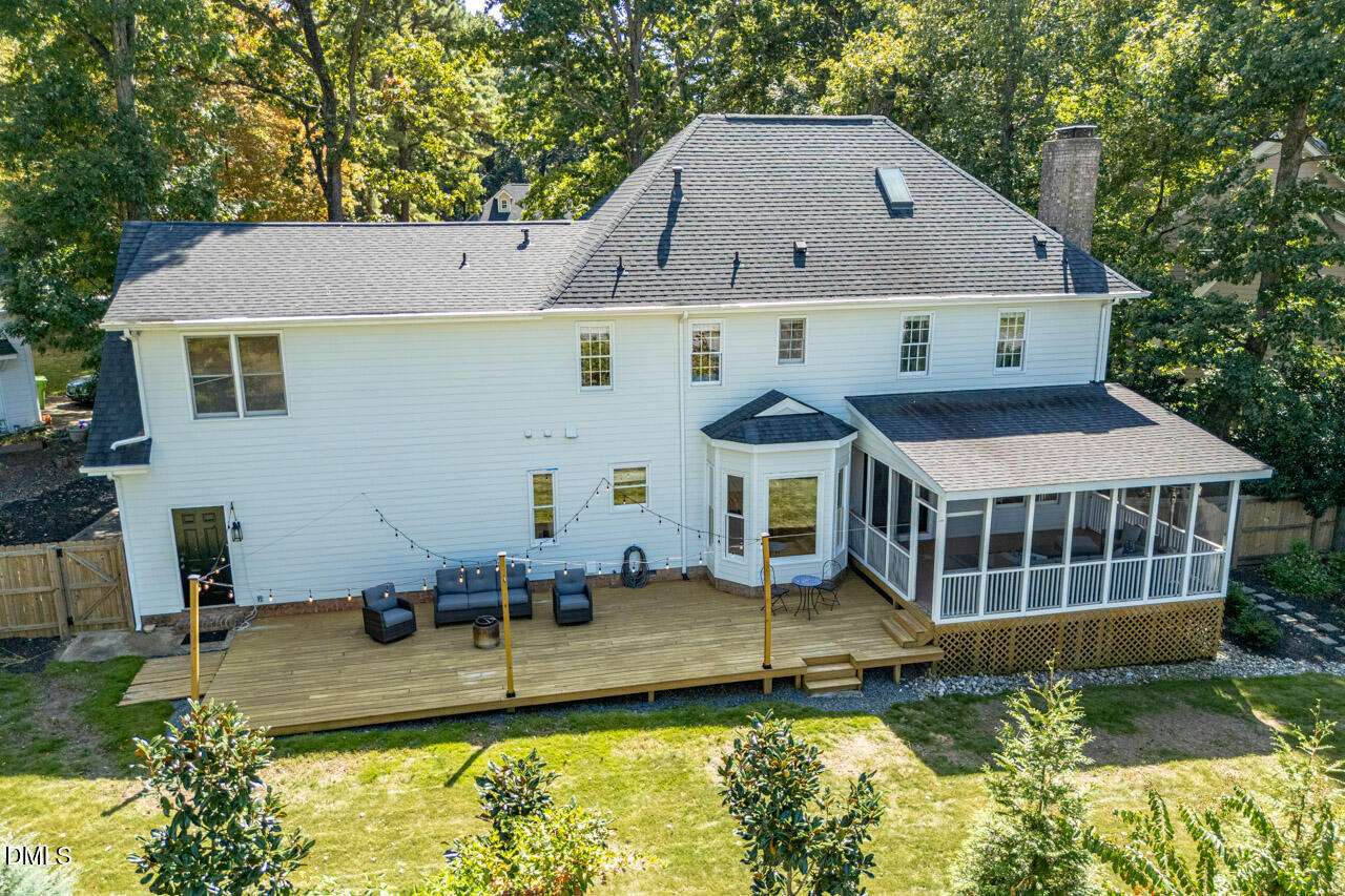 8713 Mourning Dove Road Raleigh, NC 27615 - Photo 48 of 56 a aerial view of a house with swimming pool next to a yard