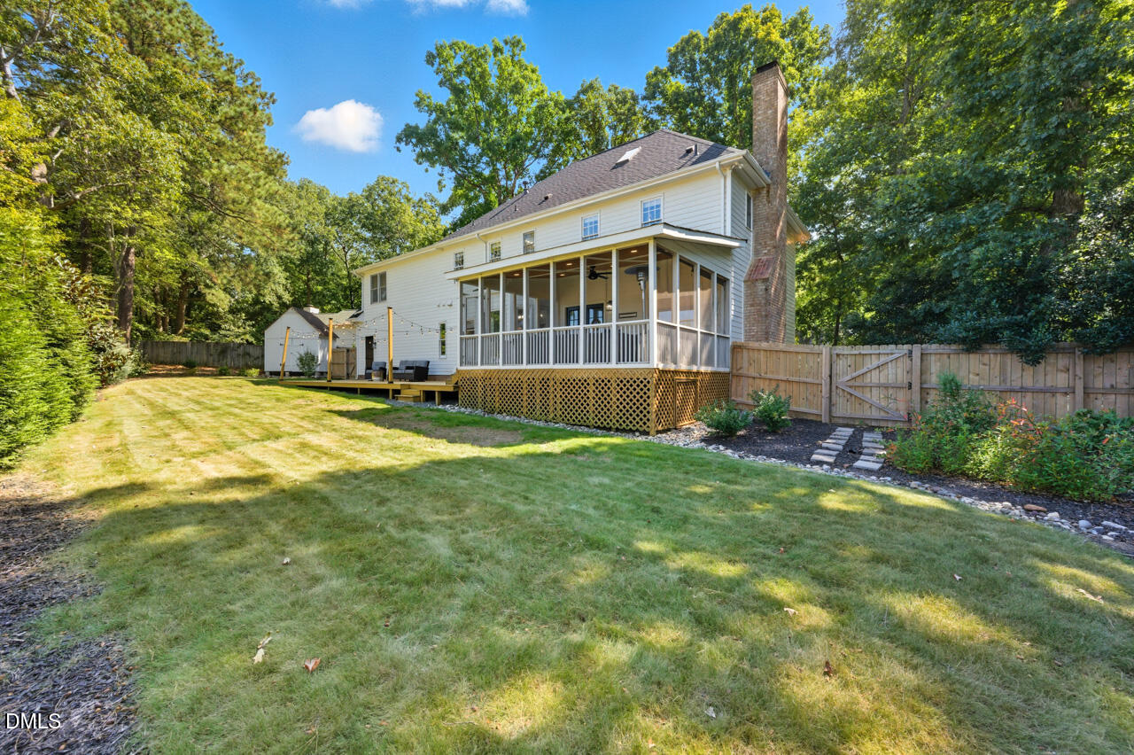 8713 Mourning Dove Road Raleigh, NC 27615 - Photo 50 of 56 a view of a house with a yard and sitting area