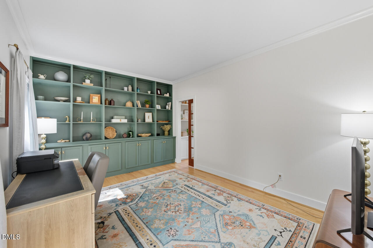 8713 Mourning Dove Road Raleigh, NC 27615 - Photo 7 of 56 a workspace with a couch