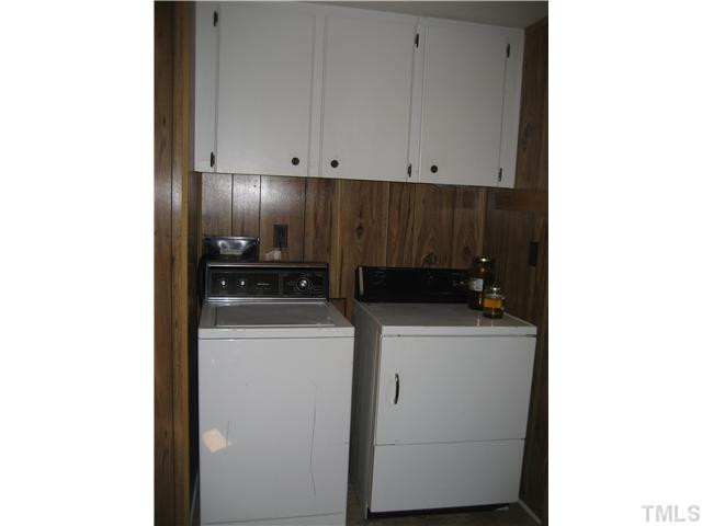 7500 Rock Service Station Road Raleigh, NC 27603 - Photo 11 of 21 a view of storage and utility room with washer and dryer