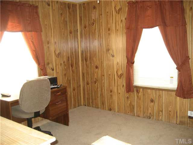 7500 Rock Service Station Road Raleigh, NC 27603 - Photo 14 of 21 a view of a door and chair in a room