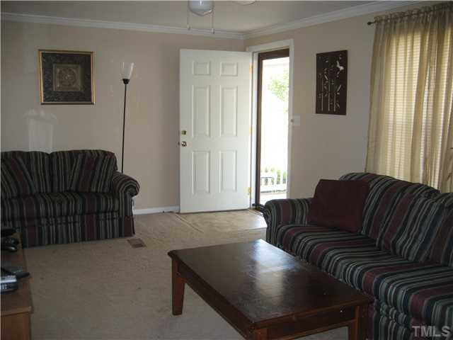 7500 Rock Service Station Road Raleigh, NC 27603 - Photo 4 of 21 a living room with furniture rug and window