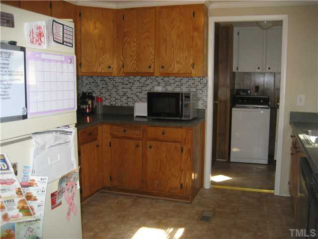 7500 Rock Service Station Road Raleigh, NC 27603 - Photo 8 of 21 a view of a storage & utility room with washer and dryer